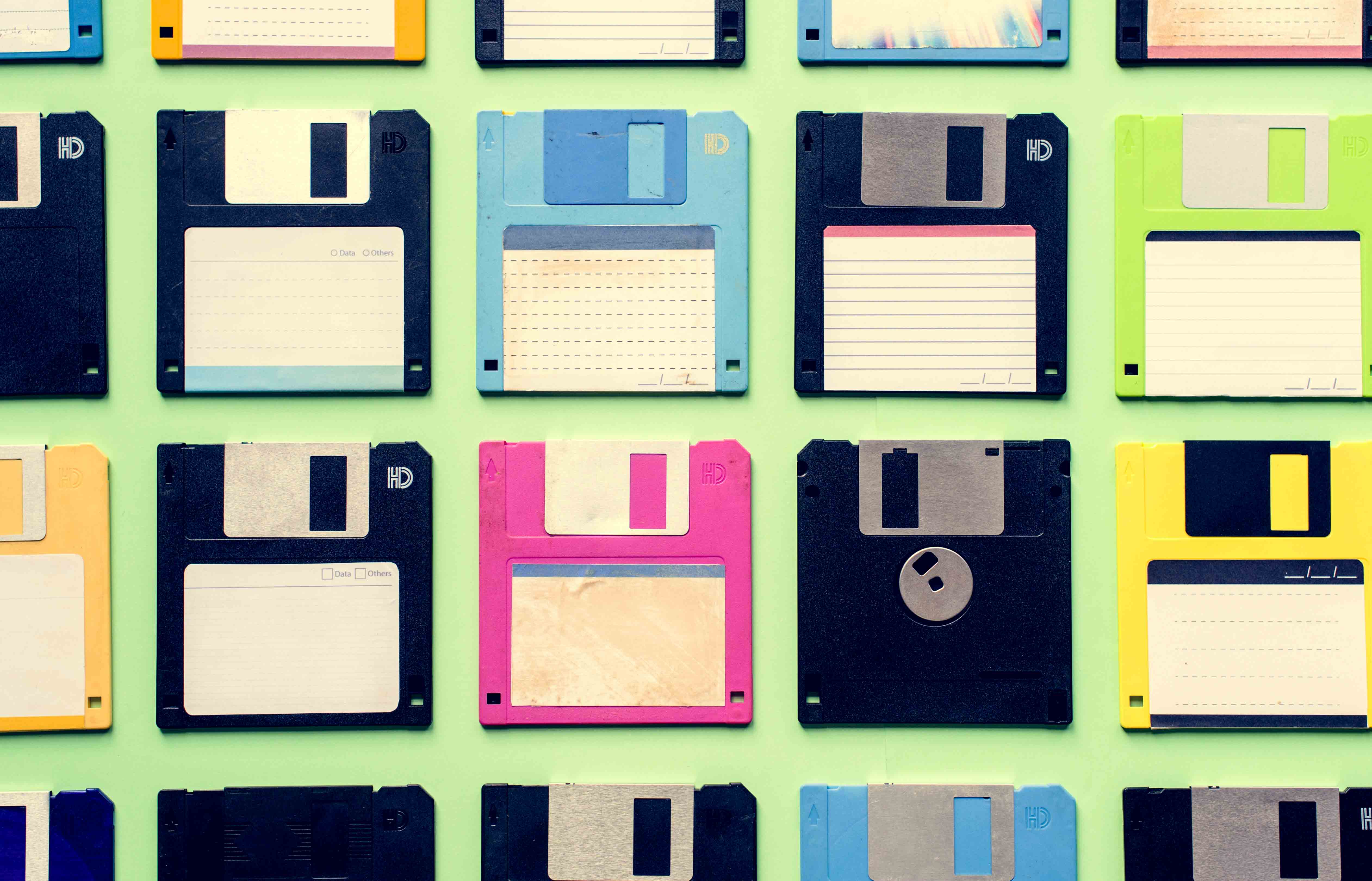 A group of diskettes arranged on a flat surface.